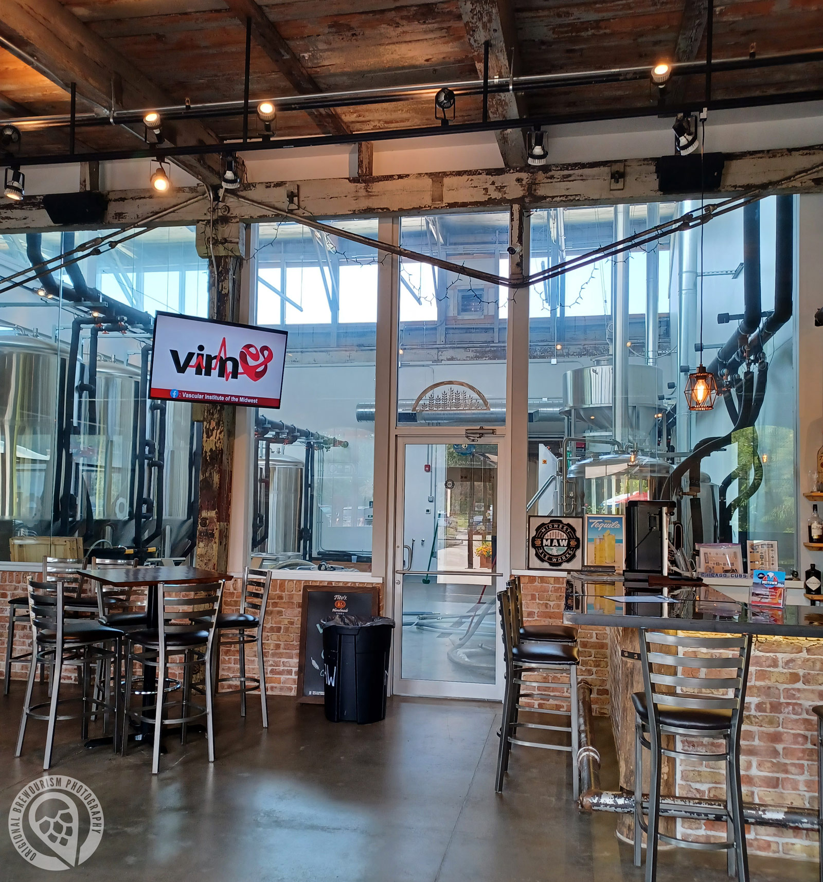 Looking into brewery tanks from the tasting room at Midwest Ale Works