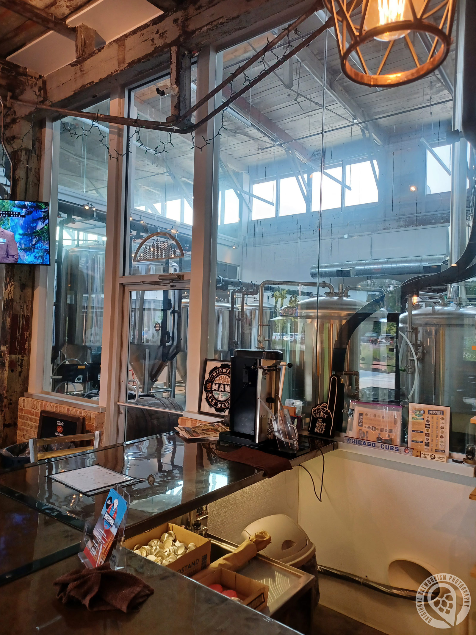 brewery tanks from the tasting room bar at Midwest Ale Works