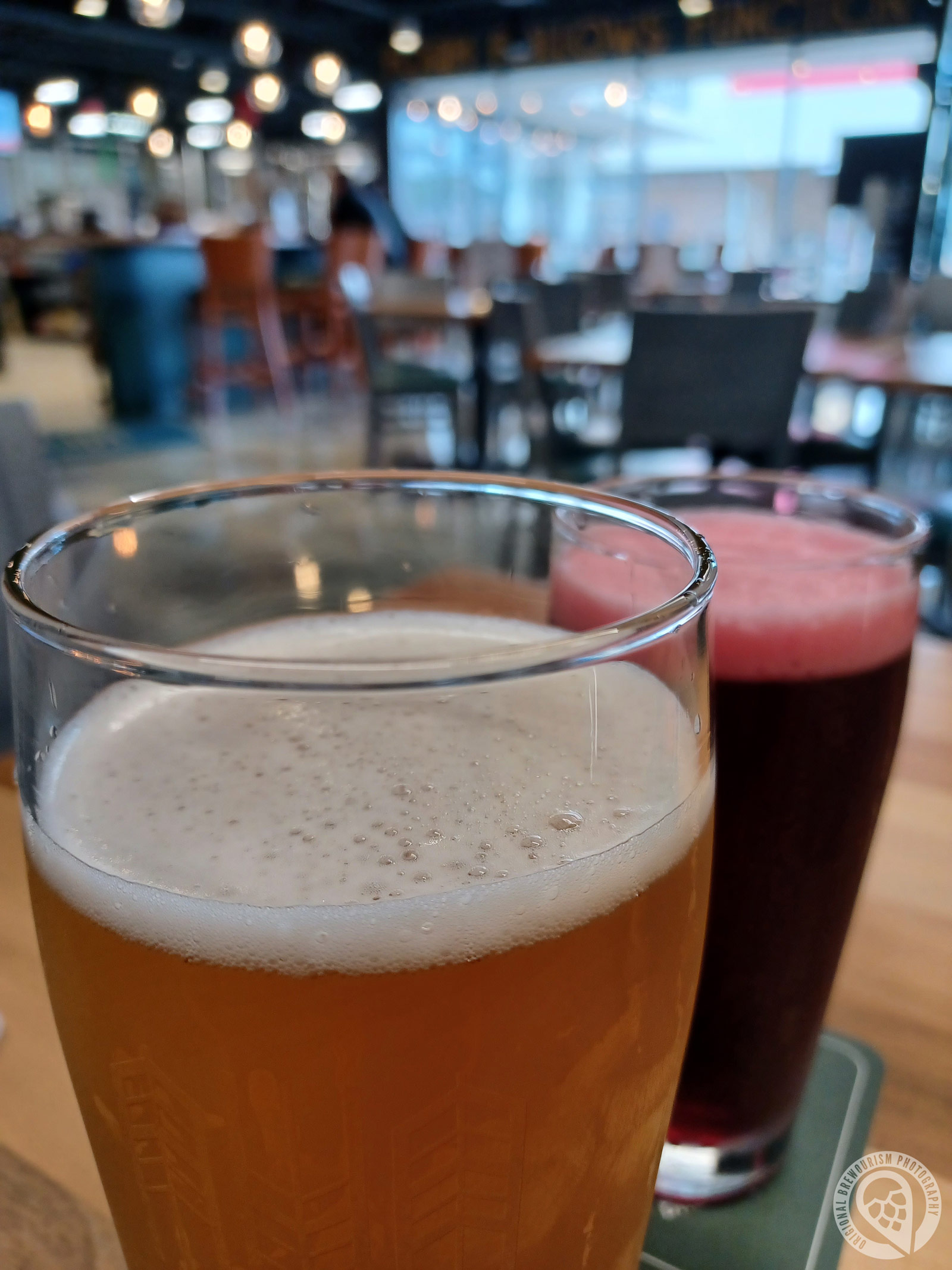 Two pints of beer on table at Art History Brewing