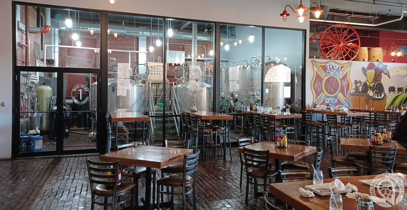 View into brewing area with tanks in Iron Spike Brewing