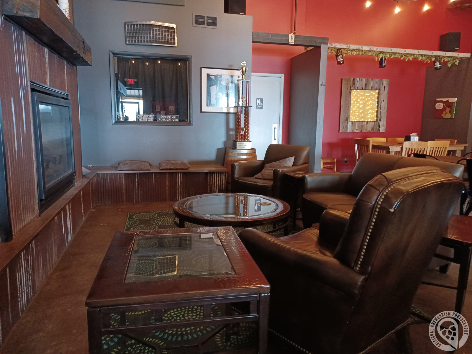 sitting area around fireplace at Contrary Brewing