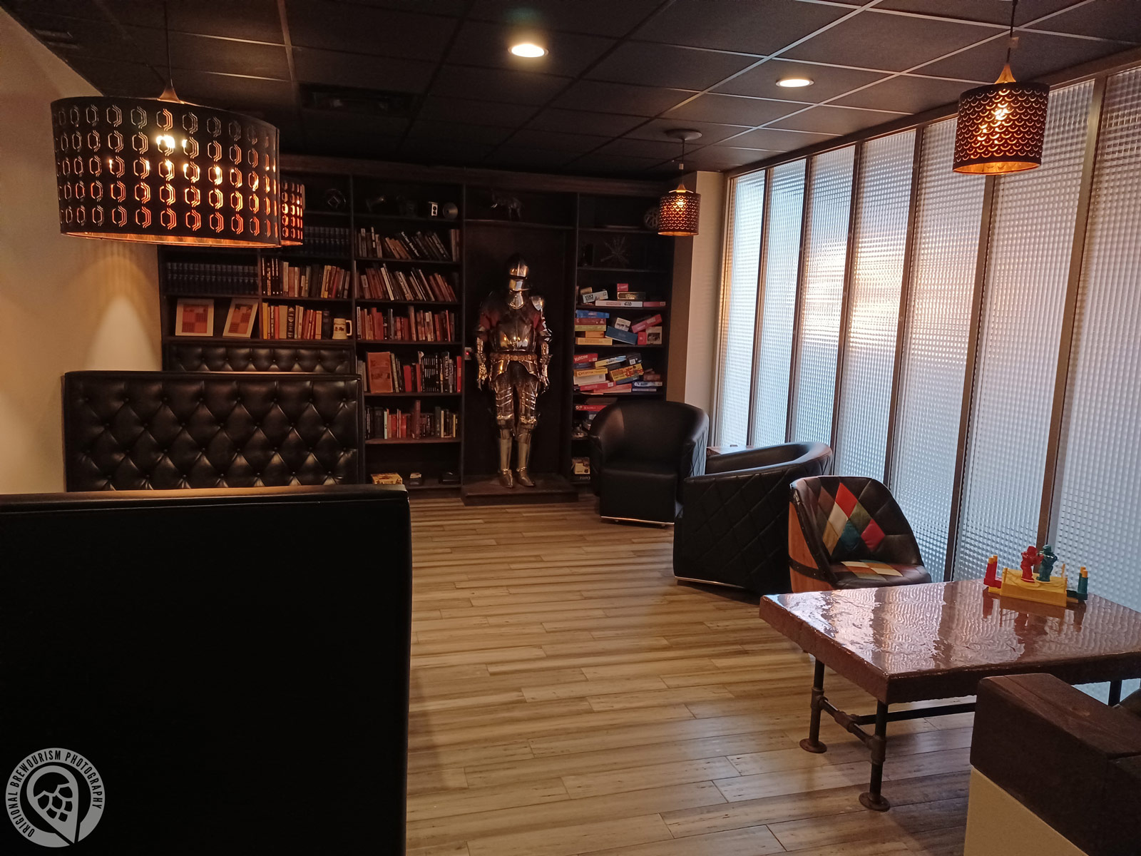 upstairs seating area with bookcase at Buzz Bomb Brewing