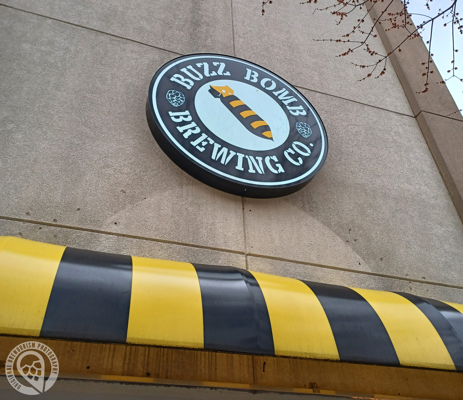Buzz Bomb Brewing logo on front of building