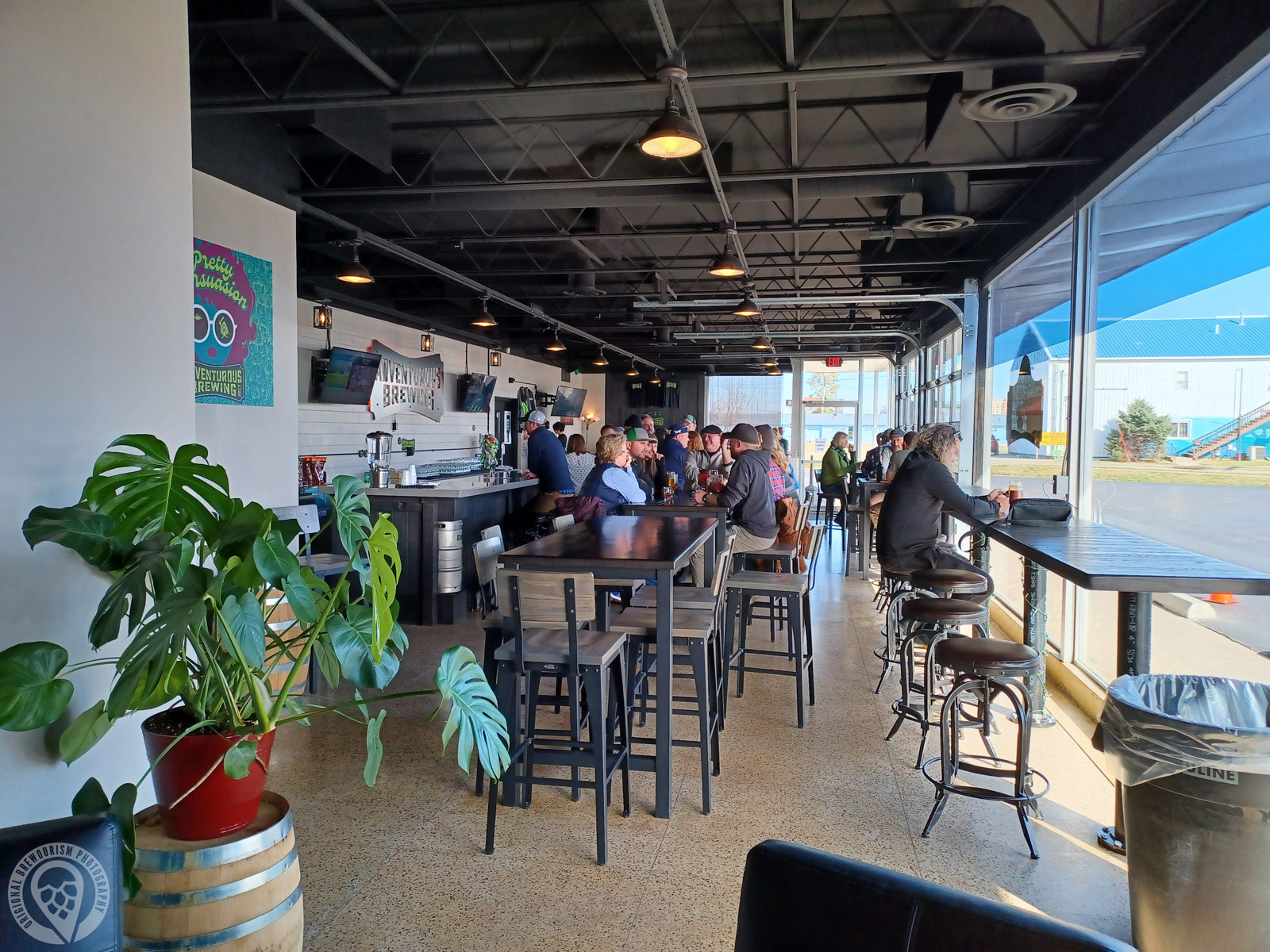 A bunch of people within the Adventurous Brewing tasting room